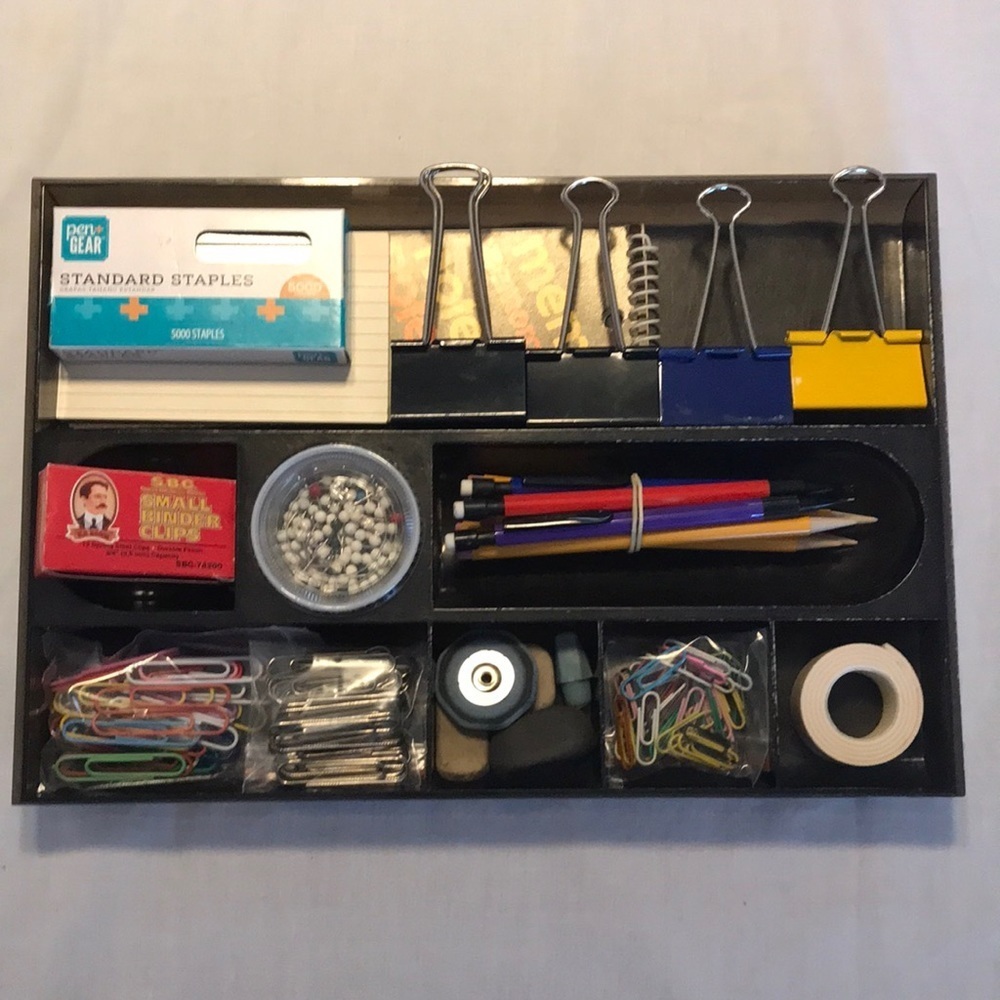 Black plastic tray and office supplies